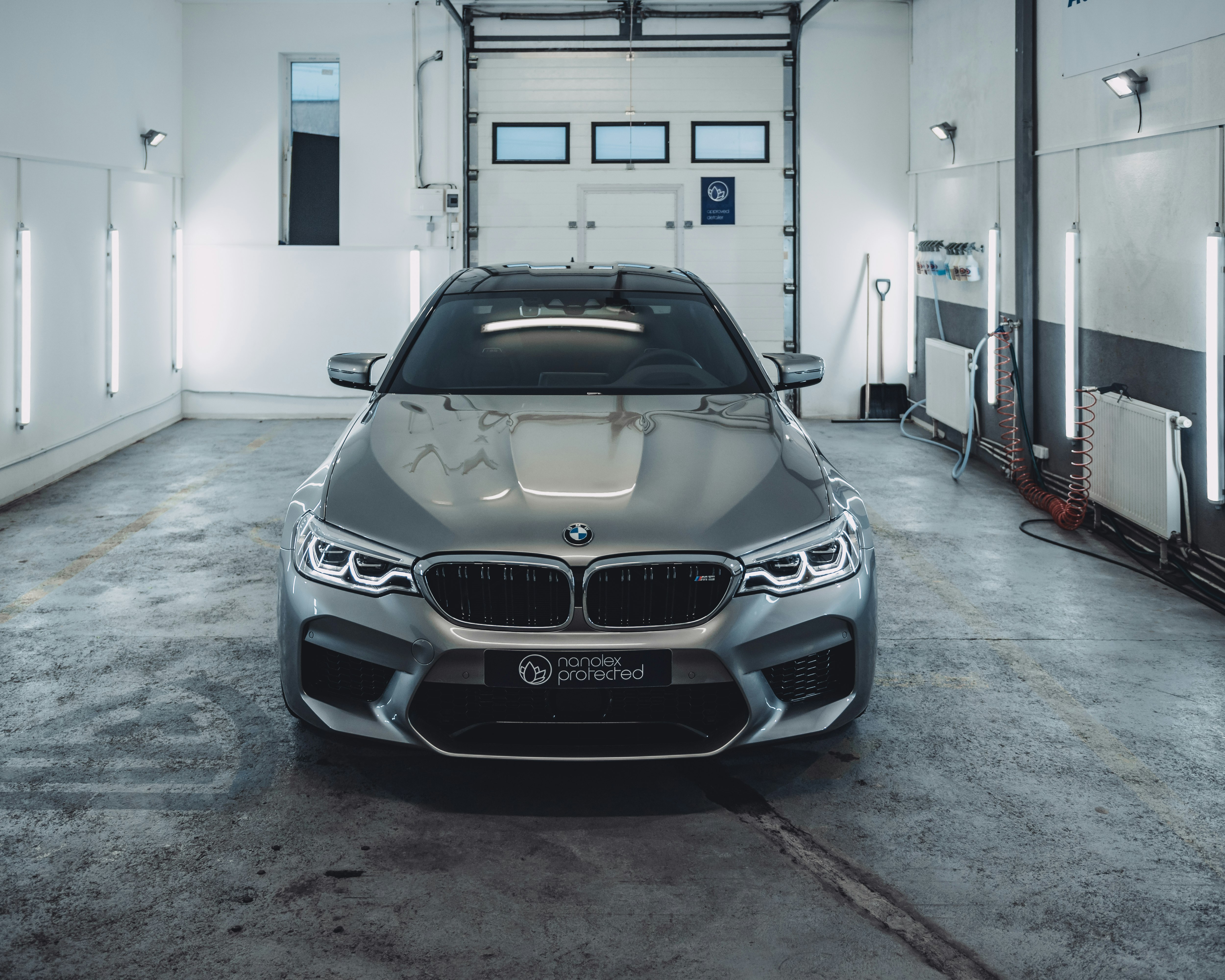 grey BMW car inside building